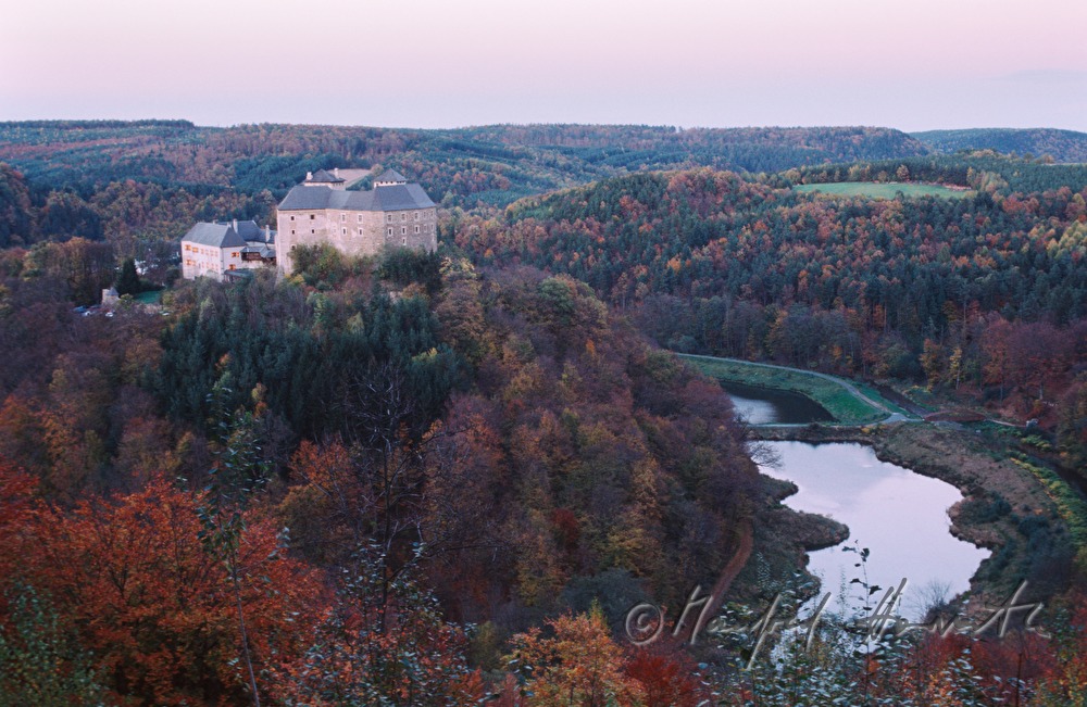 view from the Kőszeg Mountains to castle and lake