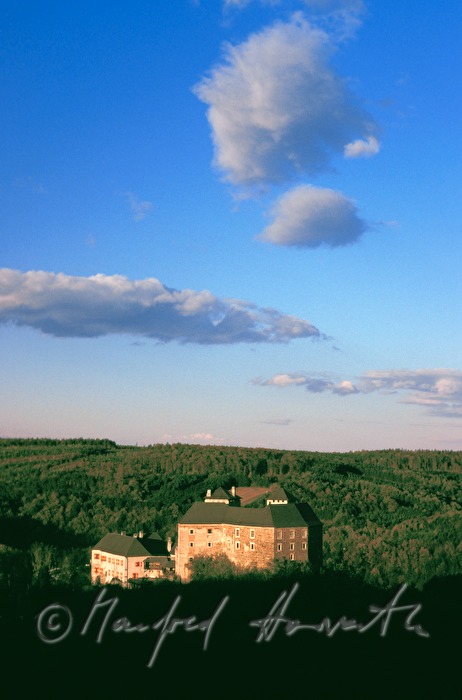 view from the Kőszeg Mountains to castle and lake