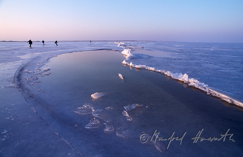 ice skaters near an ice jam