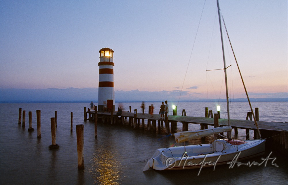 lighthouse, sailingboat, pontoon and visitors