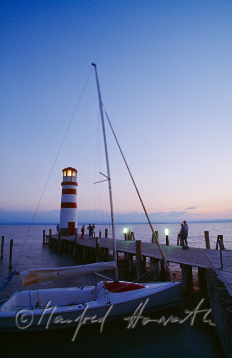 lighthouse, sailingboat, pontoon and visitors