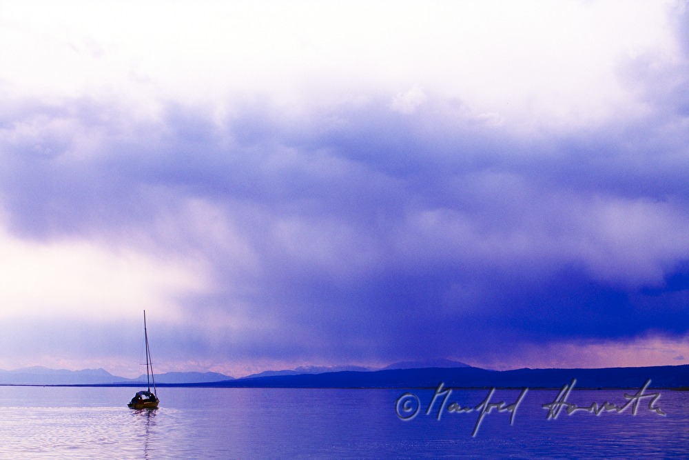 sailing boat and thunderstorm coming closer