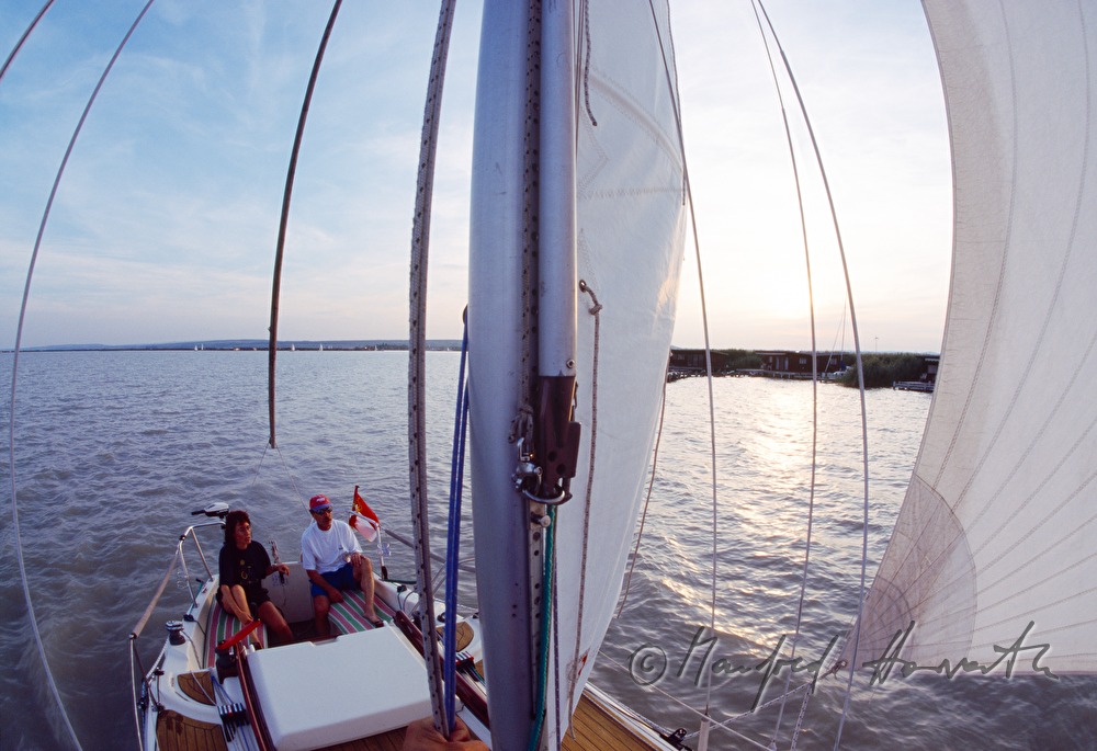 sailers steering the boat