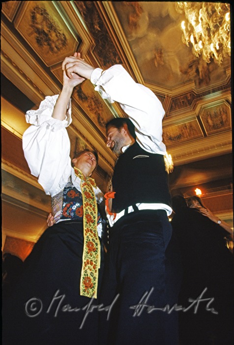 couple in traditional Croat costumes dances