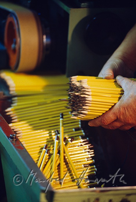 taking lead pencils from the machine