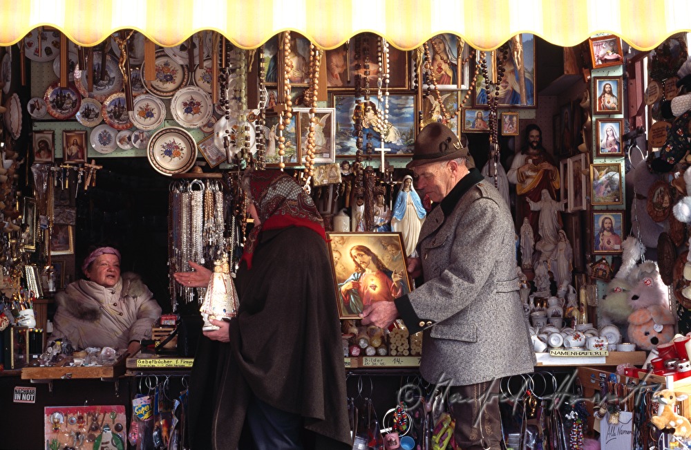 pilgrims at a souvenir stand