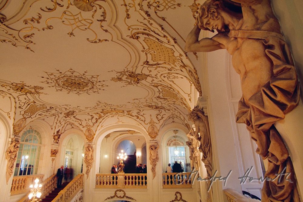 lobby with staircase and visitors