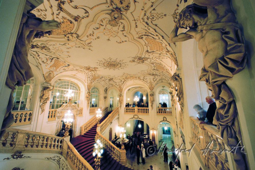 lobby with staircase and visitors