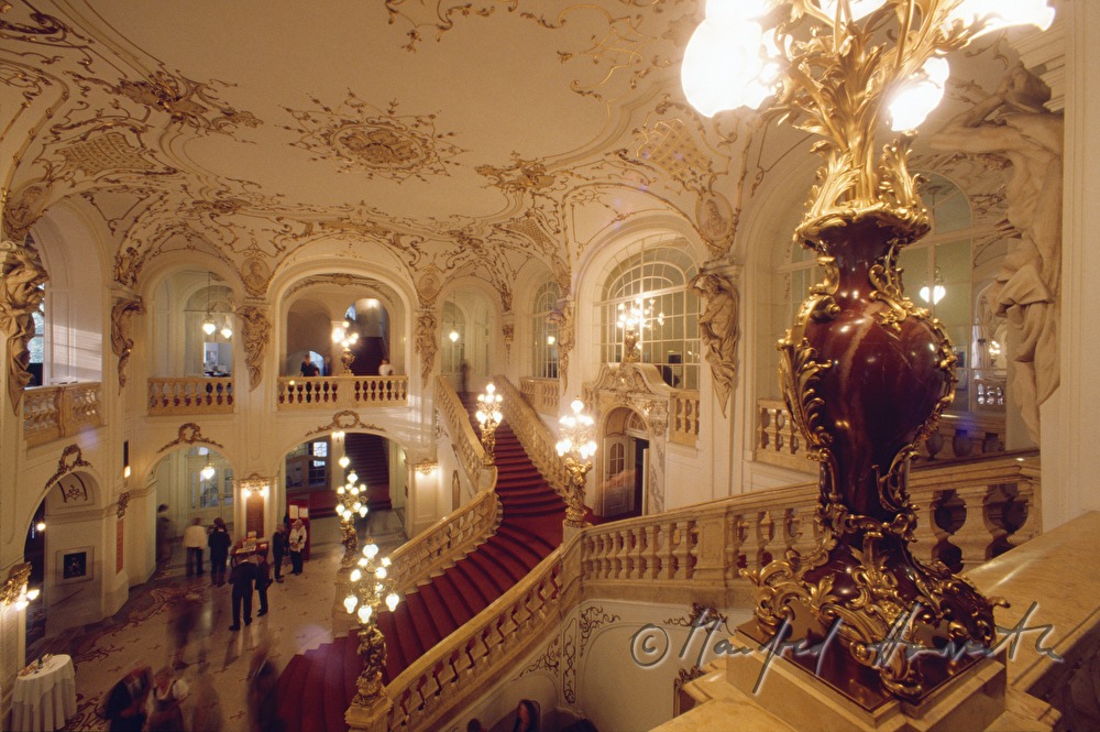 lobby with staircase and visitors