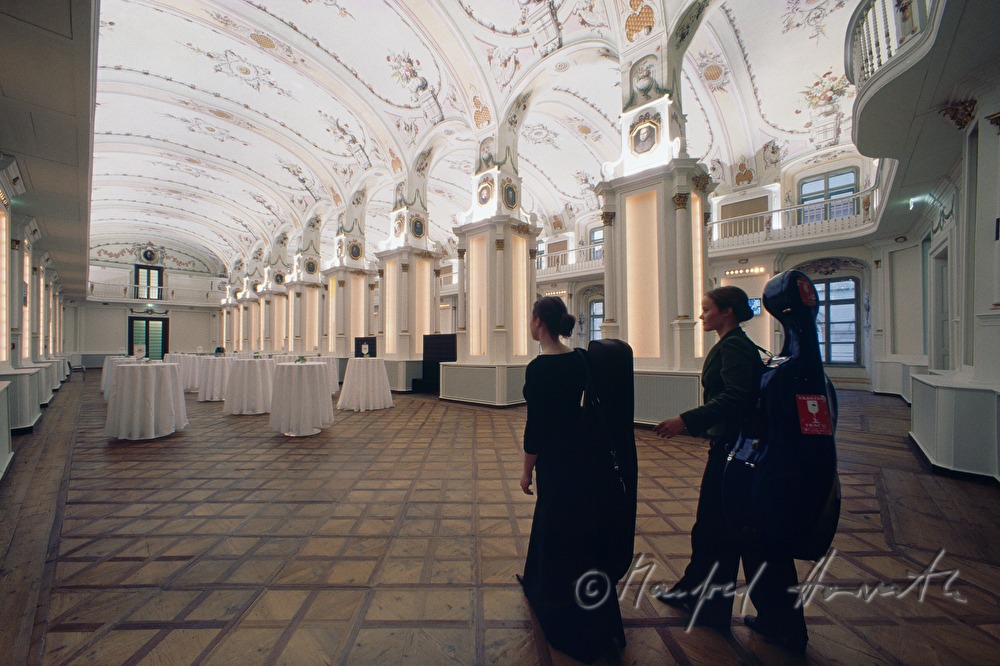 musicians walk through the assembly hall