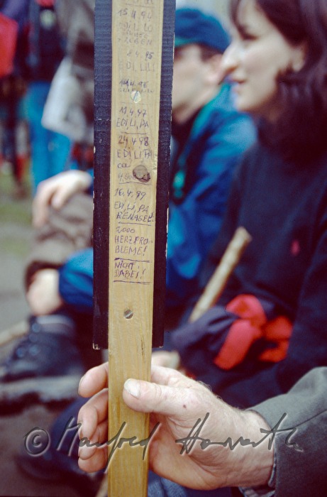 pilgrim holds a cross