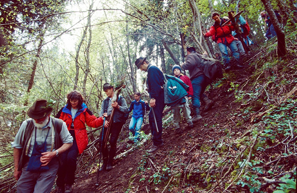 pilgrims step down the peak