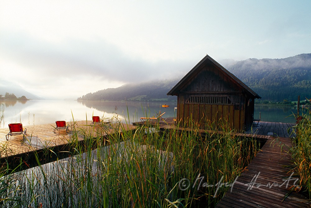 sunbeds on pontoon and boat house