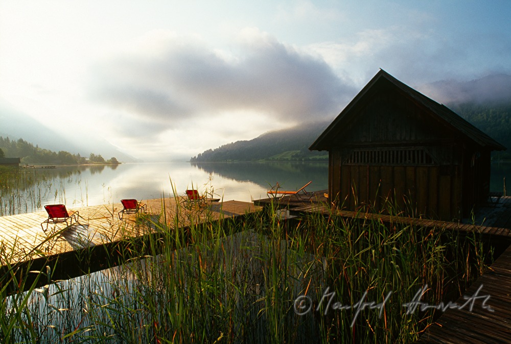 sunbeds on pontoon and boat house