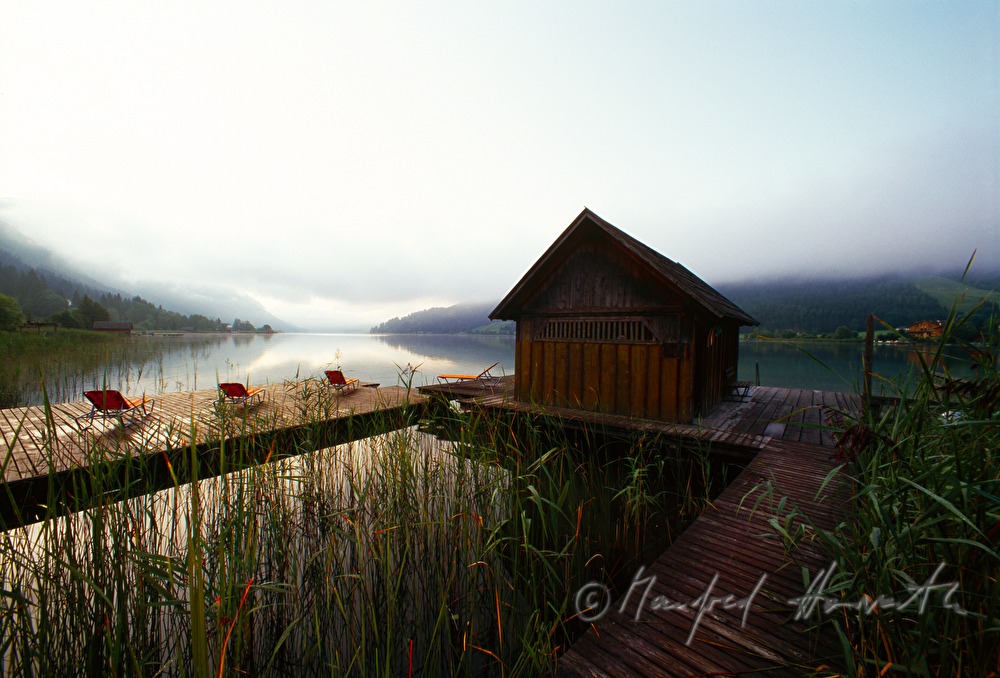 sunbeds on pontoon and boat house
