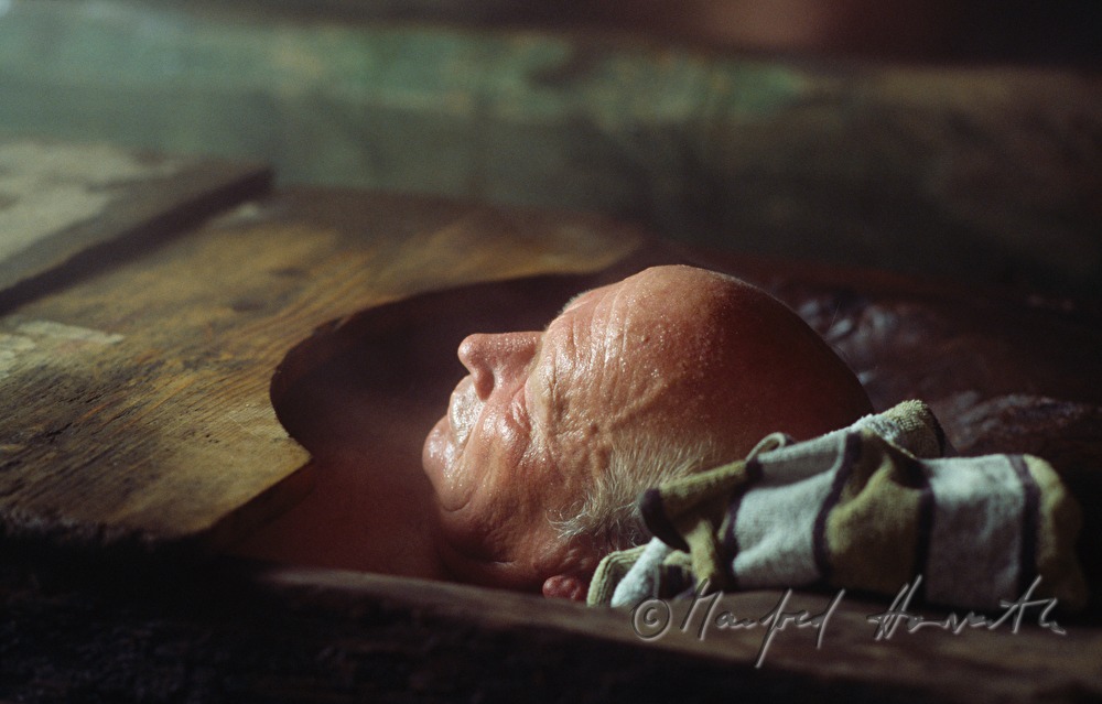 spa visitor in the wooden bathing tub