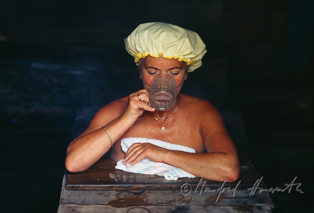 spa visitor in the wooden bathing tub