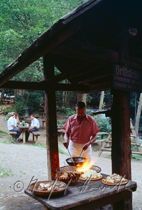 cooking Frigga on open fire