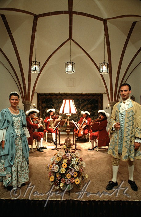 singers in baroque outfit after concert