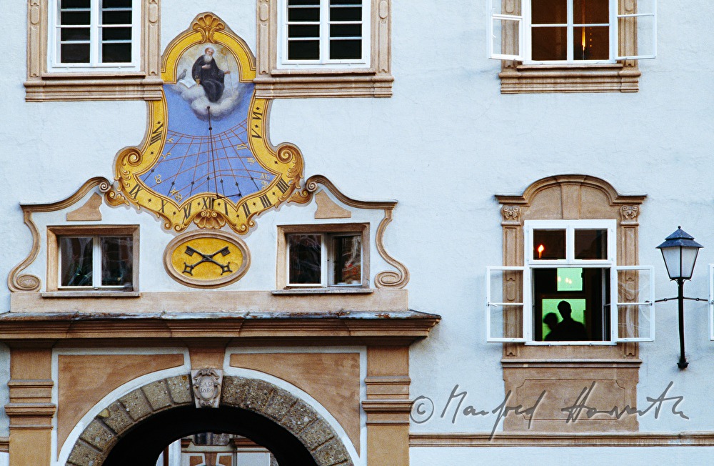 main entrance with sun dial and Saint Peter