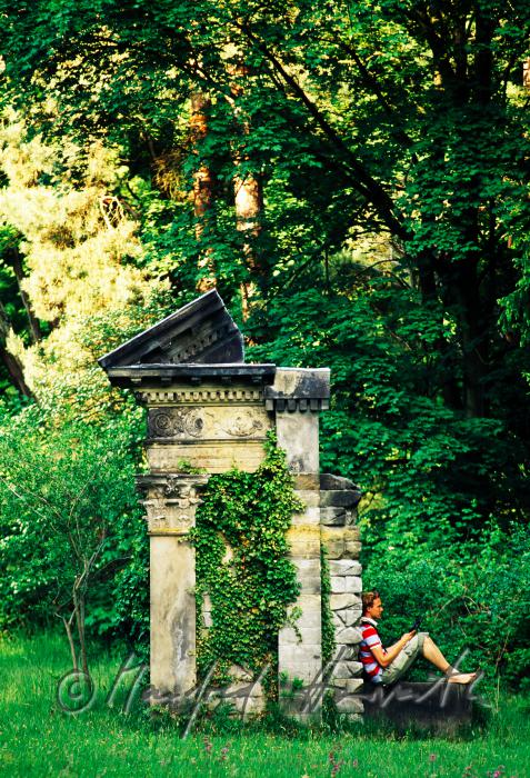 visitor rests on a  ruin
