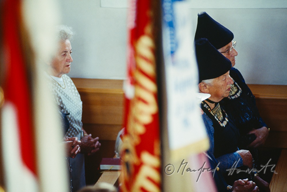 church visitors in traditional costumes