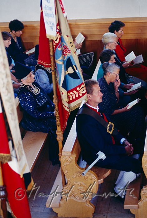 church visitors in traditional costumes