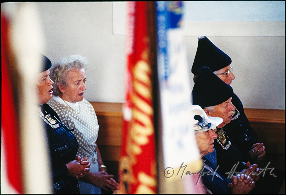 church visitors in traditional costumes