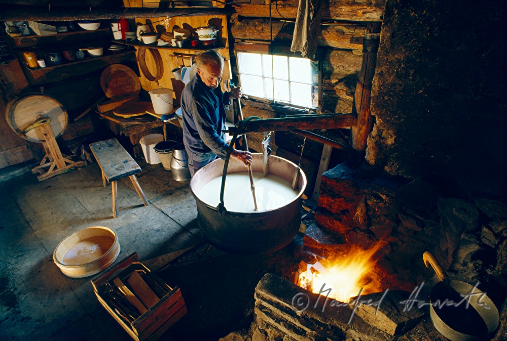 dairyman cooks milk in a kettle