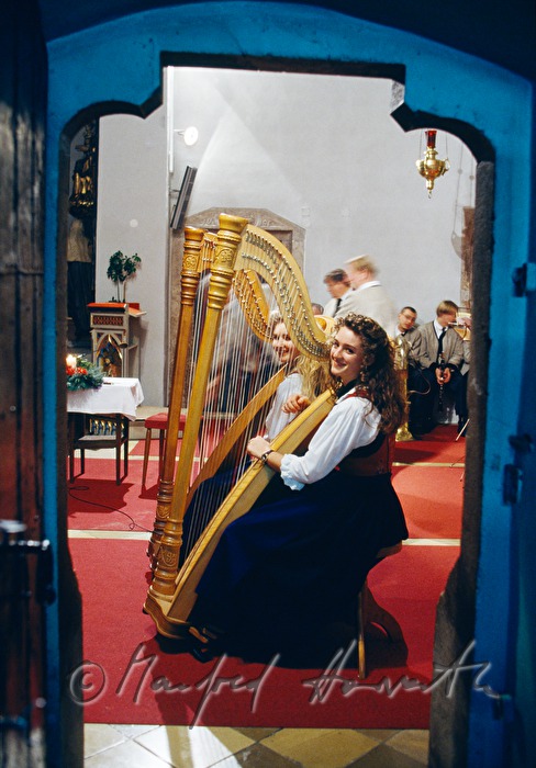 harp players in the church