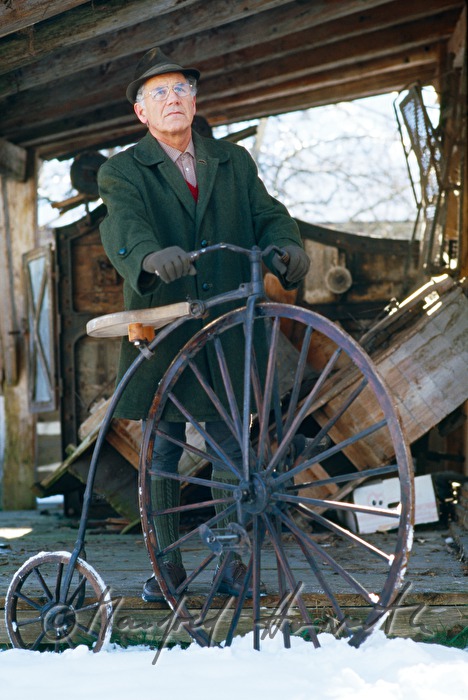 museum guide presents a penny farthing bicycle