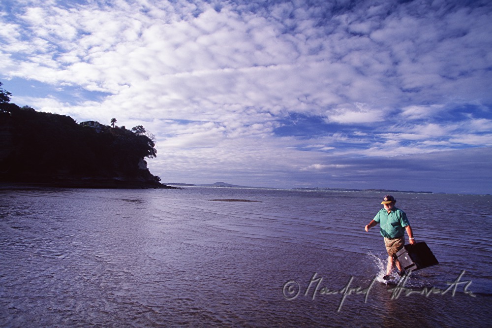 fisherman on the way to the beach