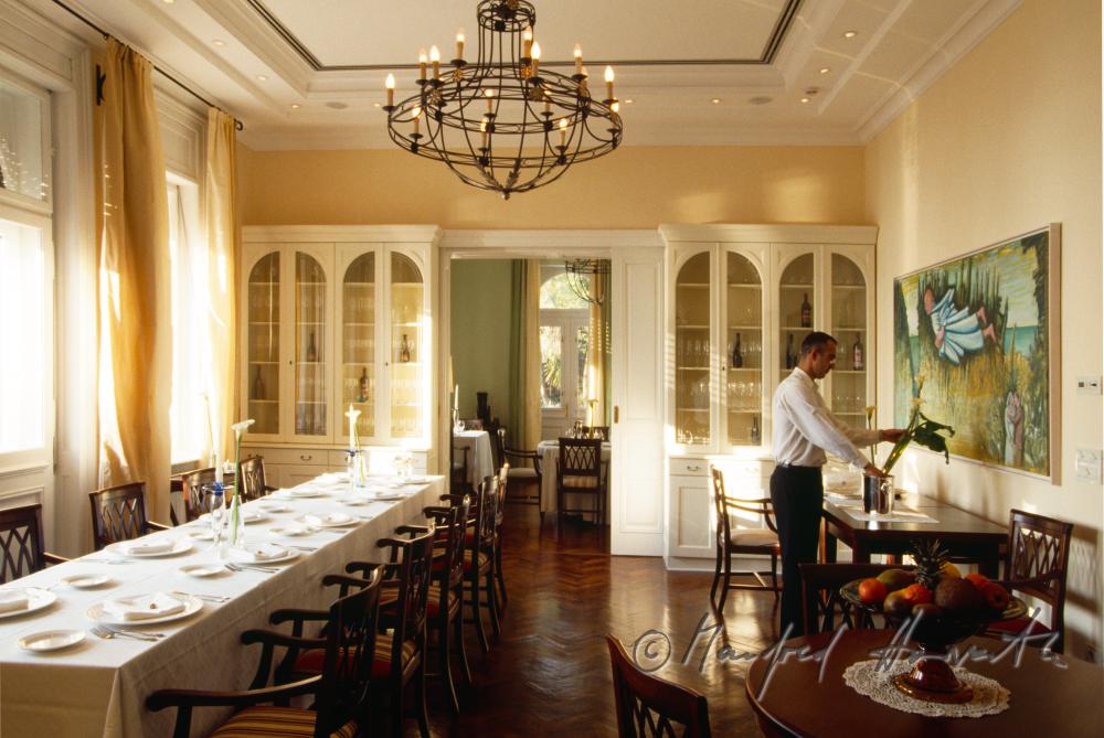 waiter in the dining room of Villa Astra