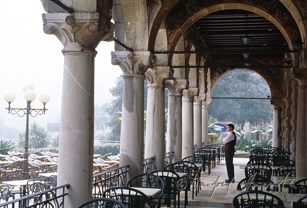 waiter on the terrace of Hotel Millenium