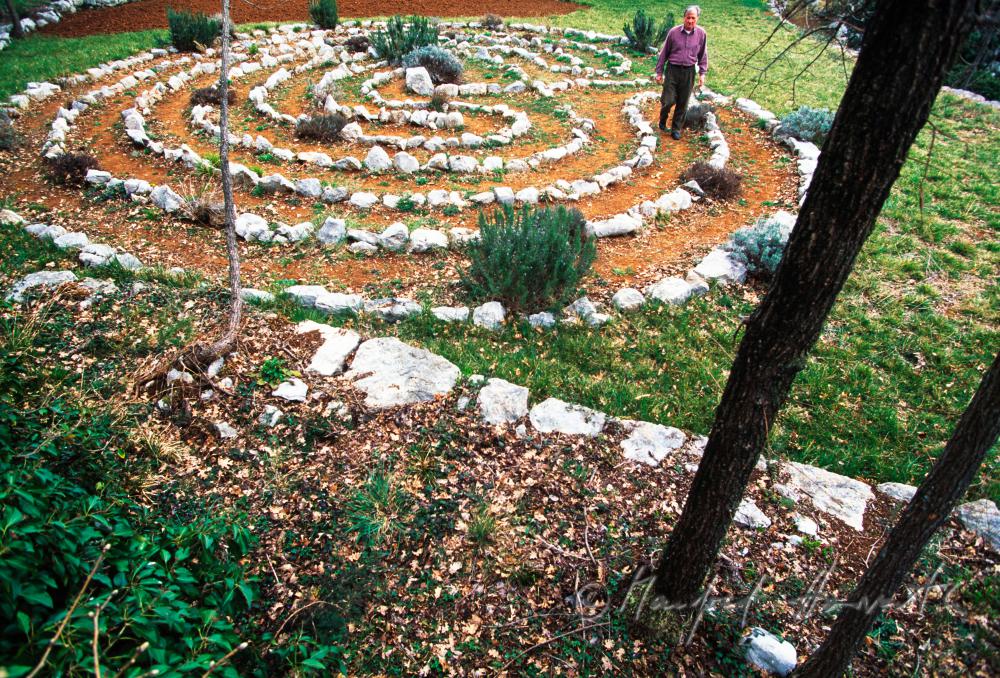 visitors walks the labyrinth in the park