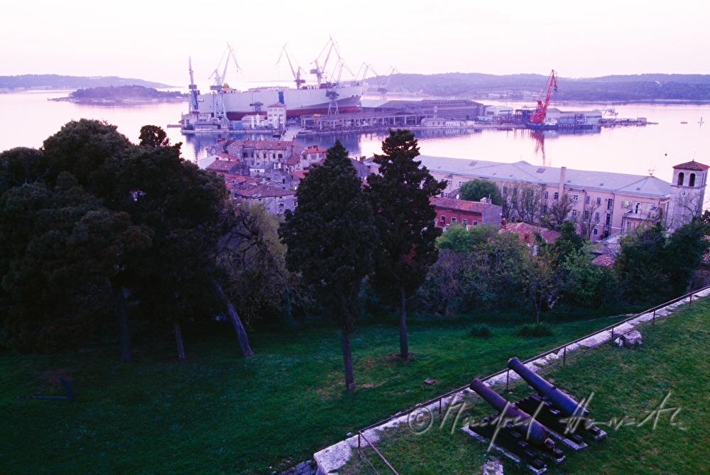 shipyard at the harbour and historic cannons