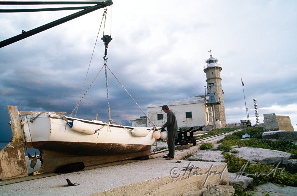 boat on the wharf of lighthouse Sveti Ivan