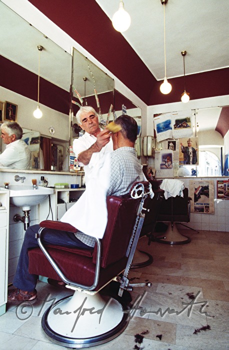 barber shaves a client