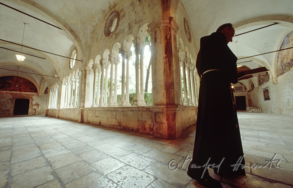 Franciscan monk in the cloister