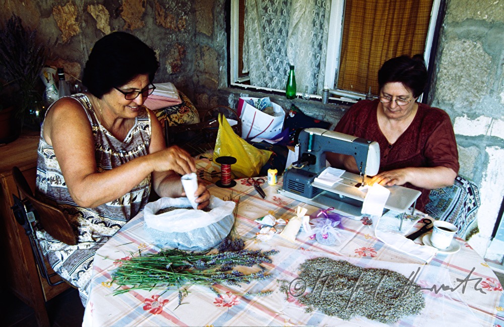 farmer women sewing lavender cushions
