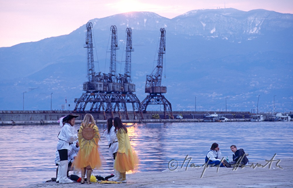 Participants of the carnival at the harbor.