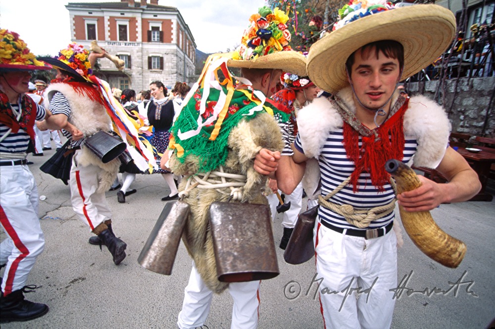 Men dressed as jacks, dance at the carnival.