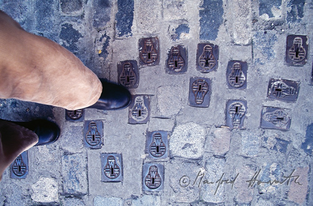 sewer covers on the pavement