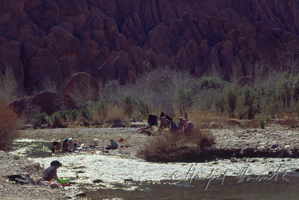 woman does the laundry in the river Dades