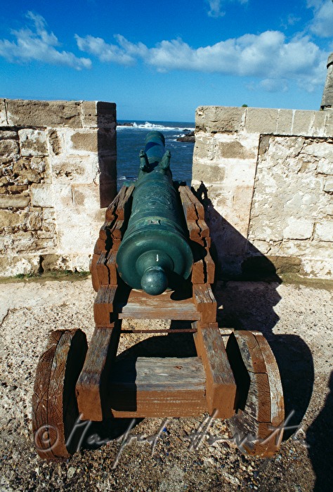 city wall and cannon on the harbor