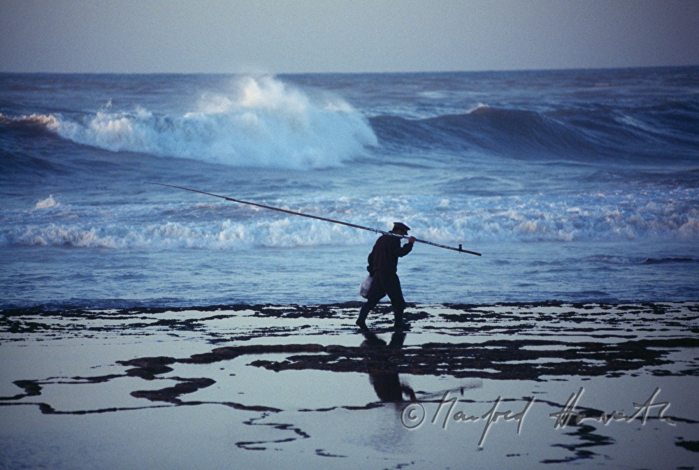 fisherman on the shore of the Atlantic Ocean