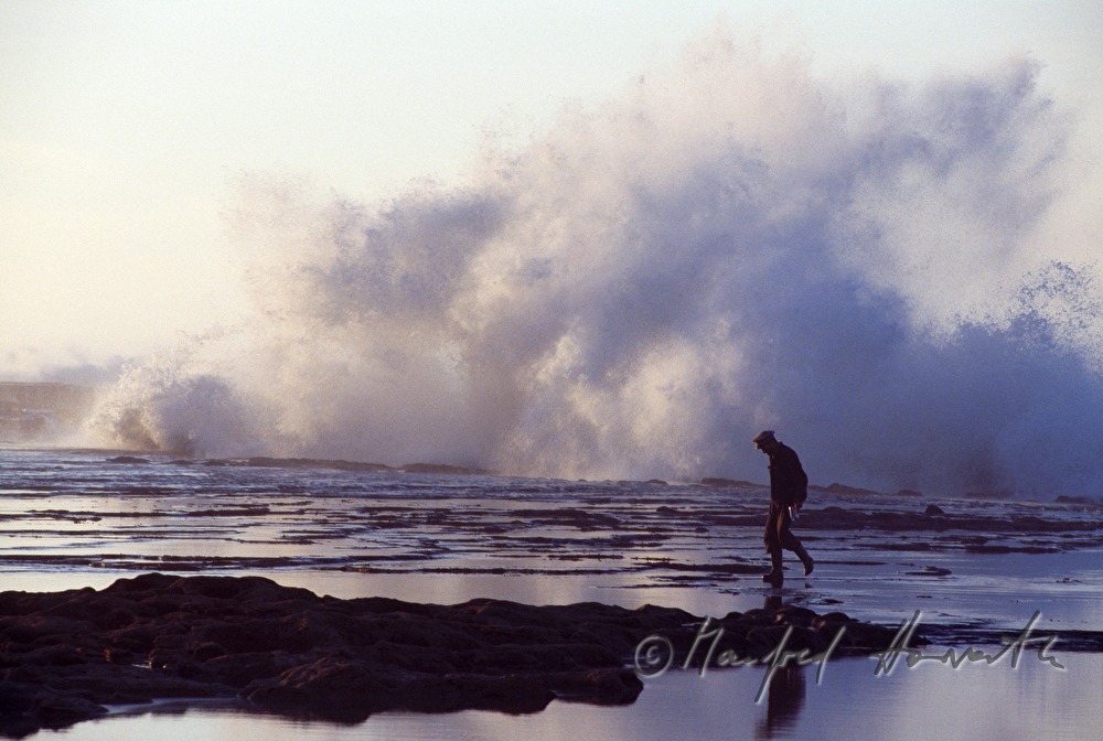 fisherman on the shore of the Atlantic Ocean