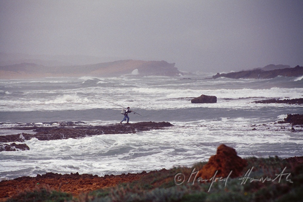 fisherman on the shore of the Atlantic Ocean