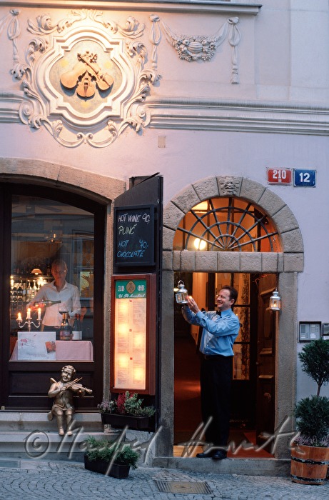 waiter lights the lantern