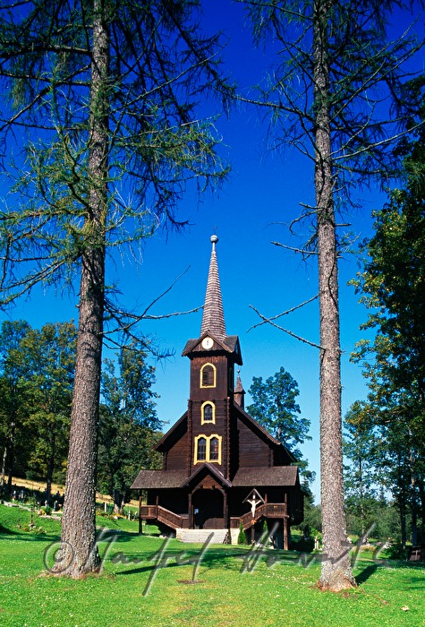 wooden church at the edge of the village